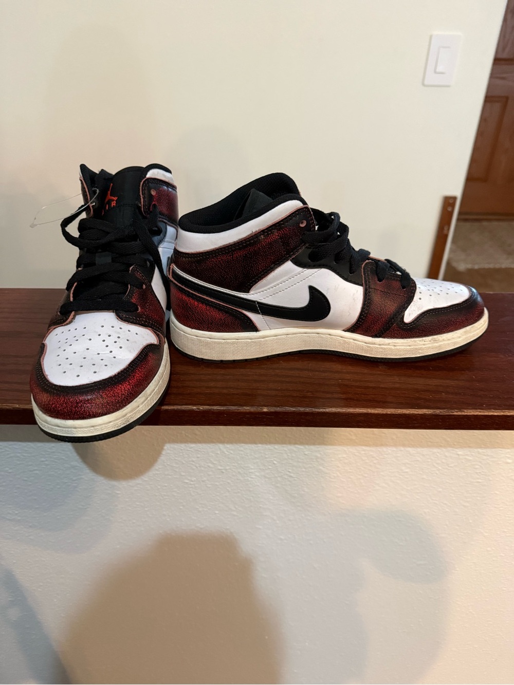 Nike Jordan’s Men’s Mid-Top Sneakers in White, Black and Red Metallic